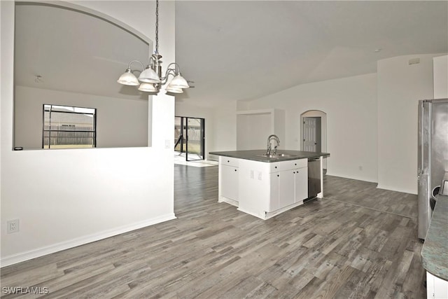 kitchen with an island with sink, sink, dishwasher, white cabinets, and pendant lighting