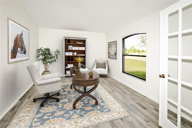 sitting room with wood finished floors and baseboards