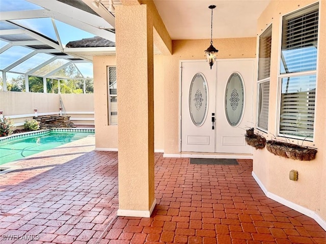 entrance to property with a patio area and a fenced in pool