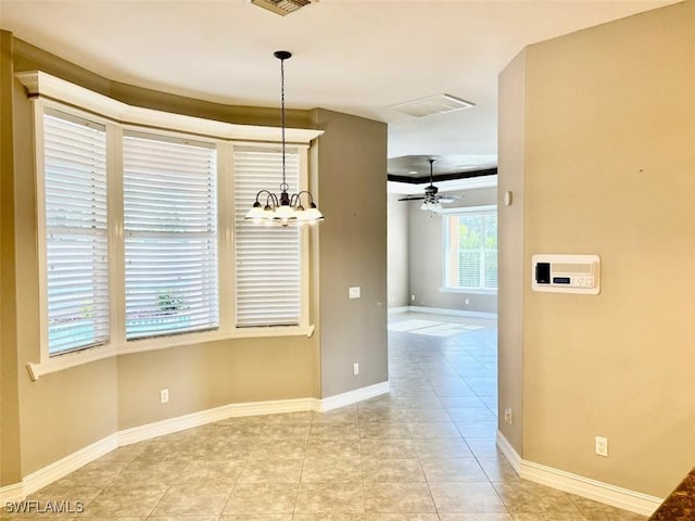 unfurnished dining area with ceiling fan with notable chandelier and light tile patterned floors