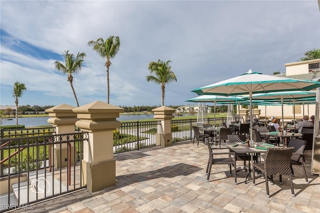 view of patio with a water view