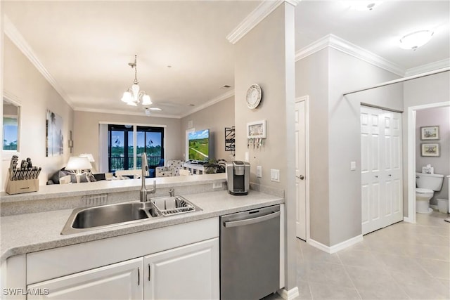 kitchen featuring an inviting chandelier, sink, stainless steel dishwasher, ornamental molding, and white cabinetry