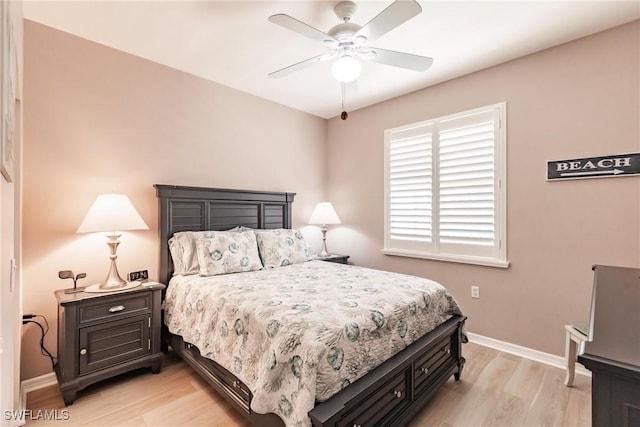 bedroom with ceiling fan and light hardwood / wood-style flooring