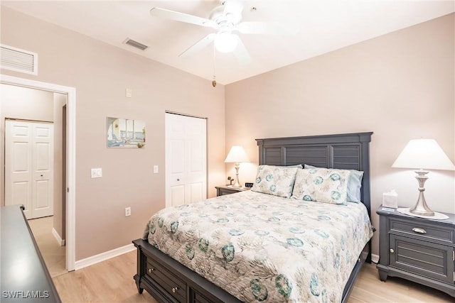 bedroom featuring a closet, light hardwood / wood-style flooring, and ceiling fan