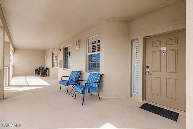 view of exterior entry with covered porch