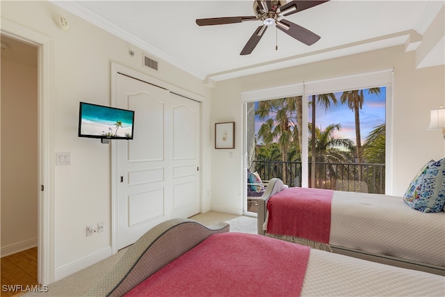 bedroom with visible vents, baseboards, carpet floors, ornamental molding, and access to exterior