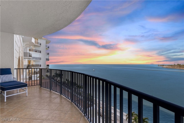 balcony featuring a water view