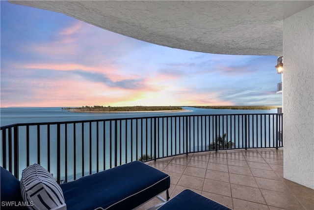 balcony at dusk with a water view