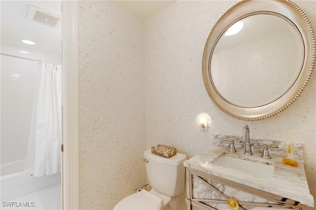 full bath featuring visible vents, toilet, vanity, and shower / tub combo