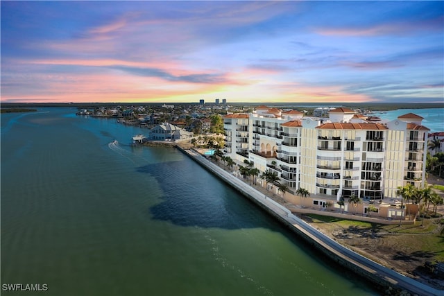 birds eye view of property featuring a water view