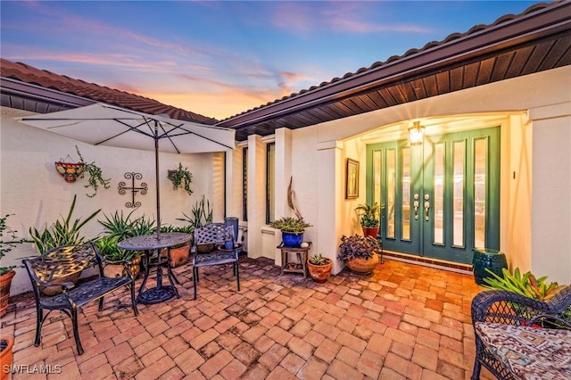 patio terrace at dusk with french doors