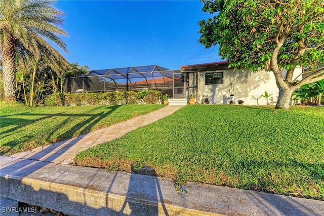 view of yard featuring glass enclosure