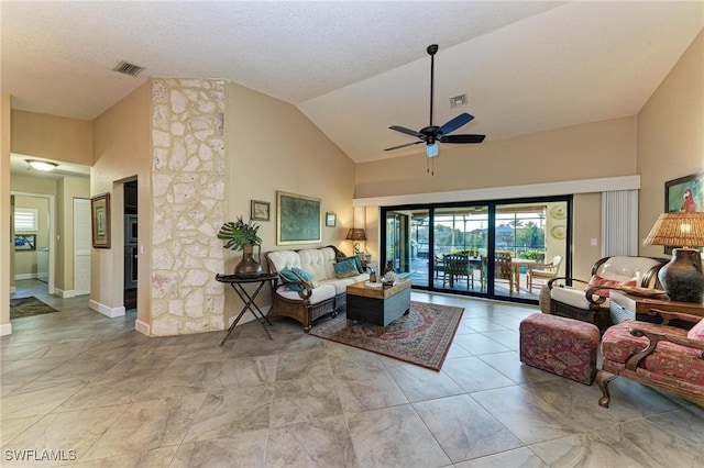 living room with high vaulted ceiling and ceiling fan