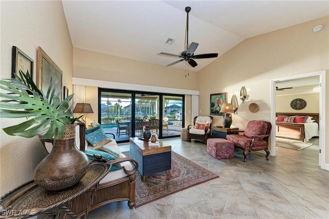 living room featuring vaulted ceiling and ceiling fan