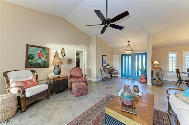 living room with french doors, ceiling fan, and lofted ceiling