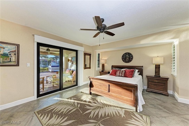 tiled bedroom with access to outside and ceiling fan