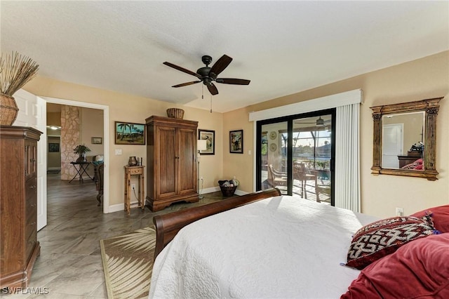 bedroom featuring ceiling fan and access to exterior