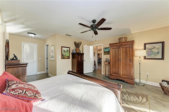 tiled bedroom with ceiling fan