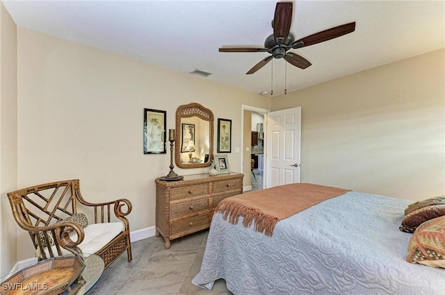 tiled bedroom featuring ceiling fan