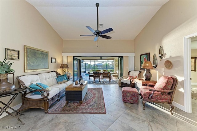 living room featuring ceiling fan and vaulted ceiling