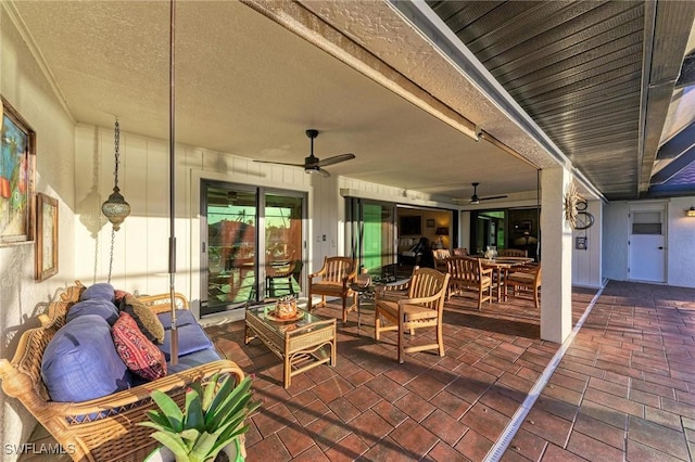 view of patio with outdoor lounge area and ceiling fan