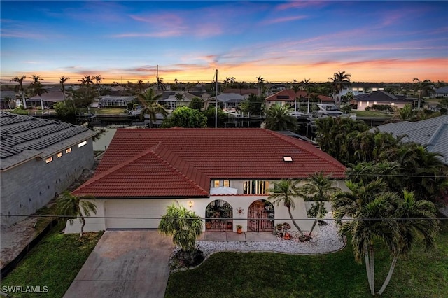 aerial view at dusk with a residential view