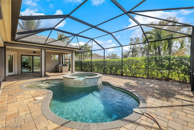 view of swimming pool featuring glass enclosure, ceiling fan, a patio area, and an in ground hot tub