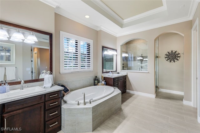 bathroom featuring vanity, separate shower and tub, and crown molding