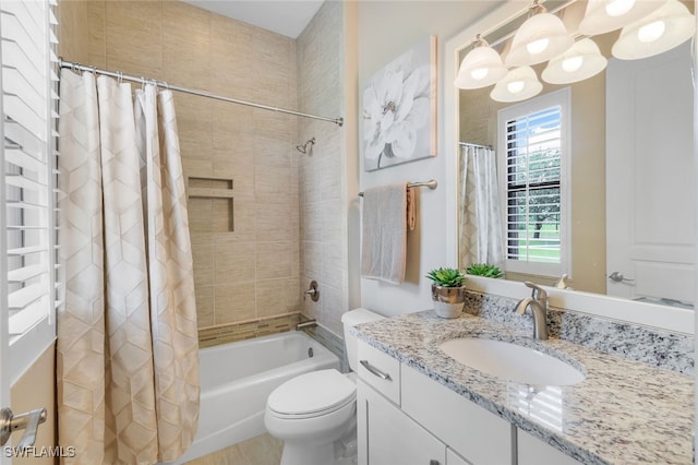 full bathroom with vanity, a chandelier, shower / bath combo, and toilet