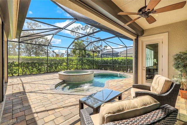 view of patio with a swimming pool with hot tub, glass enclosure, and ceiling fan