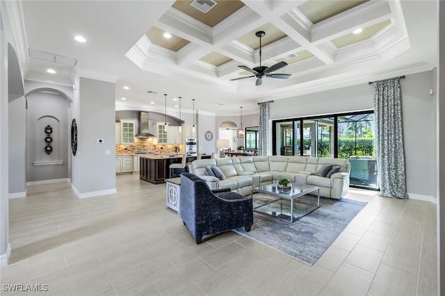 living room featuring beamed ceiling, ceiling fan, crown molding, and coffered ceiling