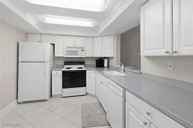 kitchen with white appliances, a tray ceiling, white cabinetry, and sink