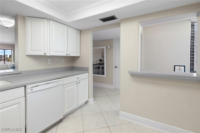 kitchen featuring dishwasher, white cabinets, ornamental molding, a tray ceiling, and light tile patterned flooring