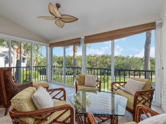 sunroom / solarium featuring ceiling fan and lofted ceiling