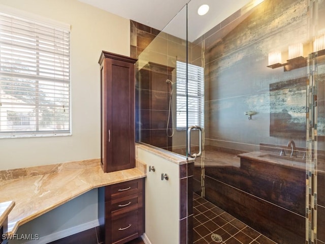 bathroom featuring tile patterned floors and a shower with shower door