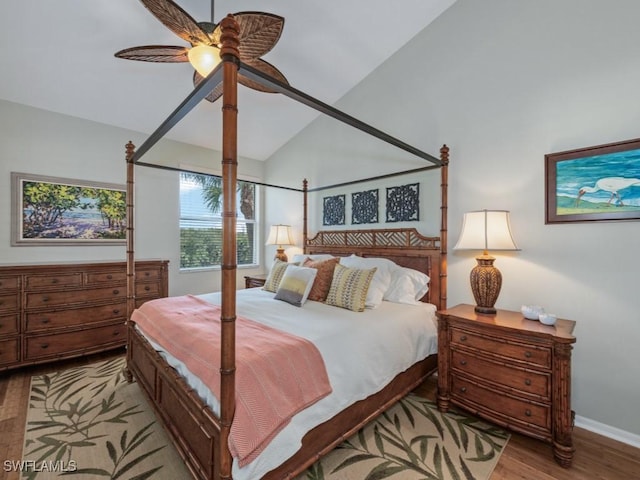 bedroom with ceiling fan, light hardwood / wood-style floors, and lofted ceiling