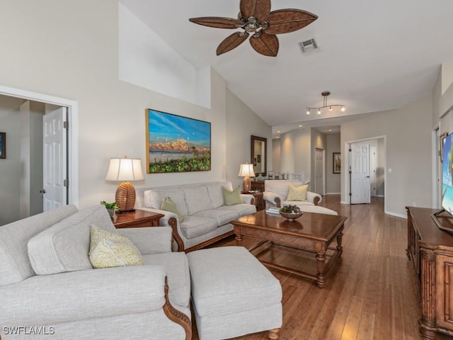 living room featuring hardwood / wood-style flooring, ceiling fan, and high vaulted ceiling