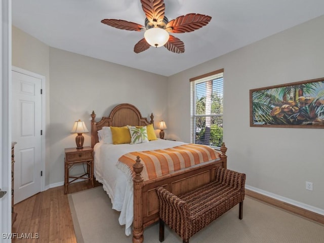 bedroom with ceiling fan and light hardwood / wood-style floors