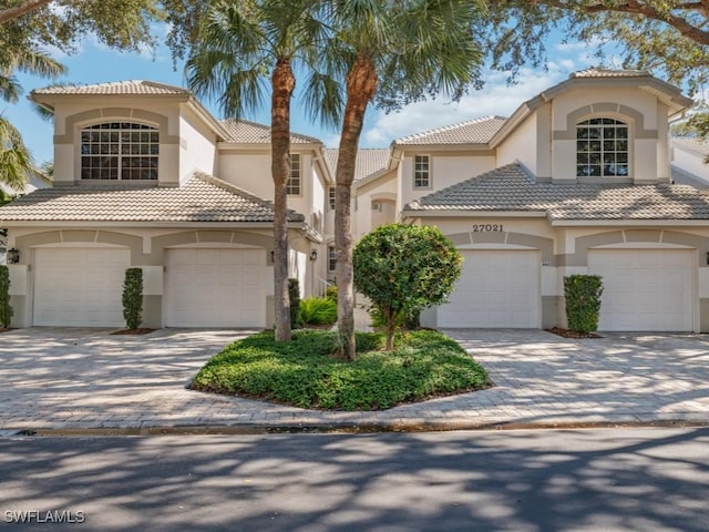 mediterranean / spanish-style home featuring a garage