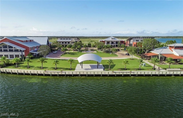 drone / aerial view with a water view and a residential view