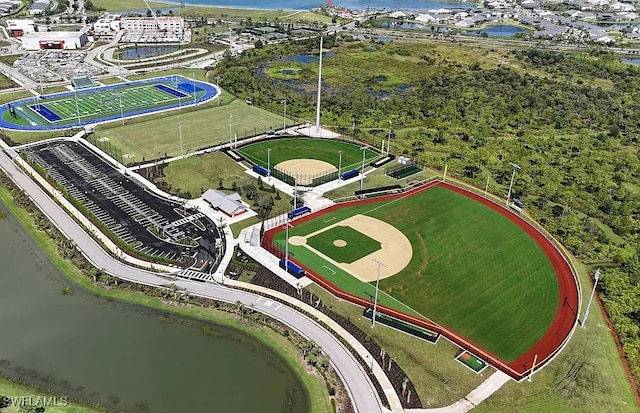 birds eye view of property with a water view