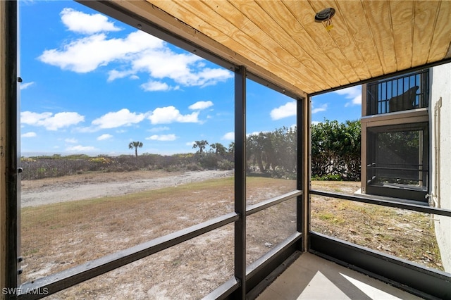 unfurnished sunroom featuring wooden ceiling