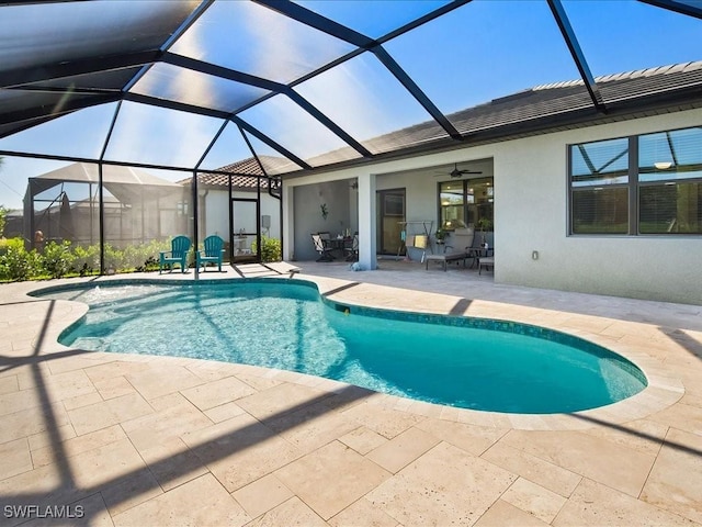 view of swimming pool featuring glass enclosure, ceiling fan, and a patio area