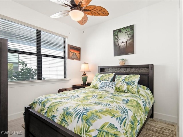 bedroom featuring hardwood / wood-style floors and ceiling fan