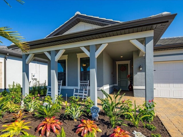 view of front of house featuring a porch and a garage