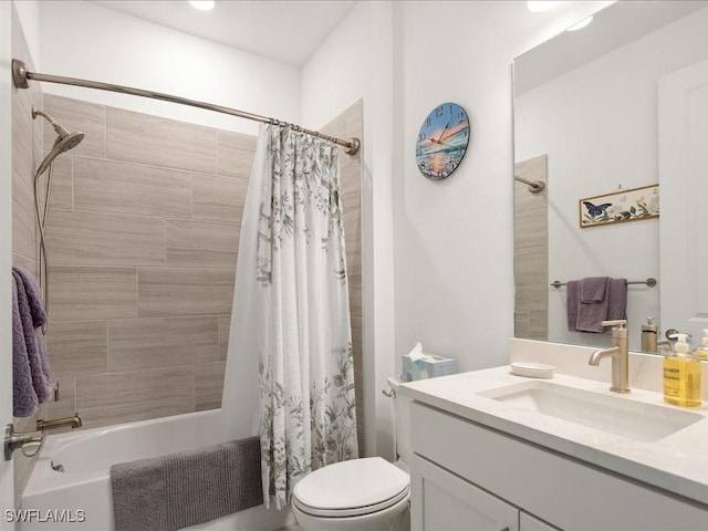 full bathroom with vanity, toilet, and shower / tub combo