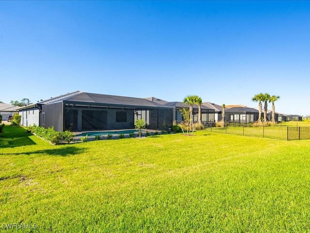 view of yard with a lanai and a fenced in pool