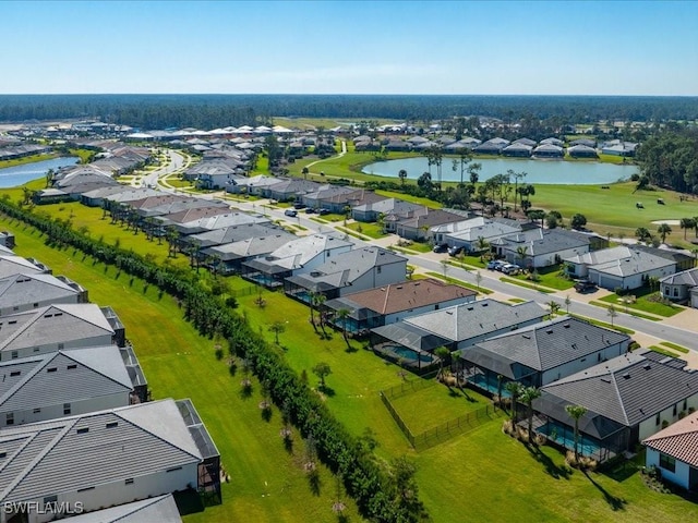 drone / aerial view with a water view