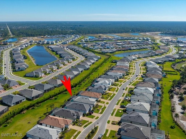 birds eye view of property with a water view