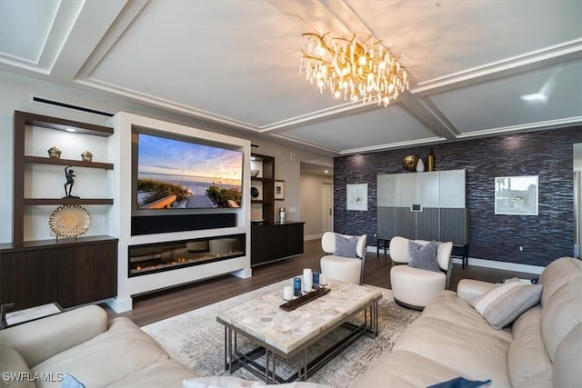 cinema featuring dark hardwood / wood-style flooring and a chandelier